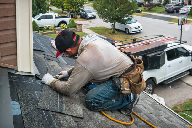 Professional Emergency Roof Repair technician working in Monroe, CT